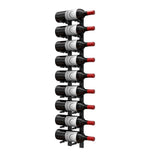 Wall-mounted wine bottle peg rack with multiple dark bottles and red corks