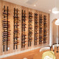 Wine peg wall rails holding bottles along a wooden wall