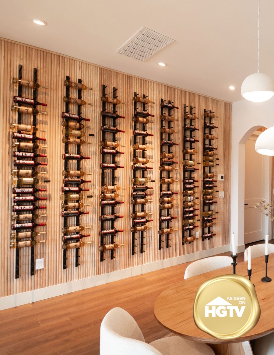 Wine peg wall rails holding bottles along a wooden wall