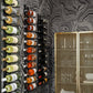 Wall wine peg rails with stacked bottles and black peg holders