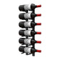 Wall-mounted wine bottle peg rack with multiple dark bottles and red corks