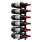 Wall-mounted wine bottle peg rack with multiple dark bottles and red corks