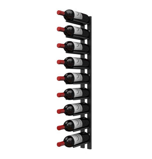 Black wall-mounted wine rack rail with multiple cork-out bottle pegs and dark bottles