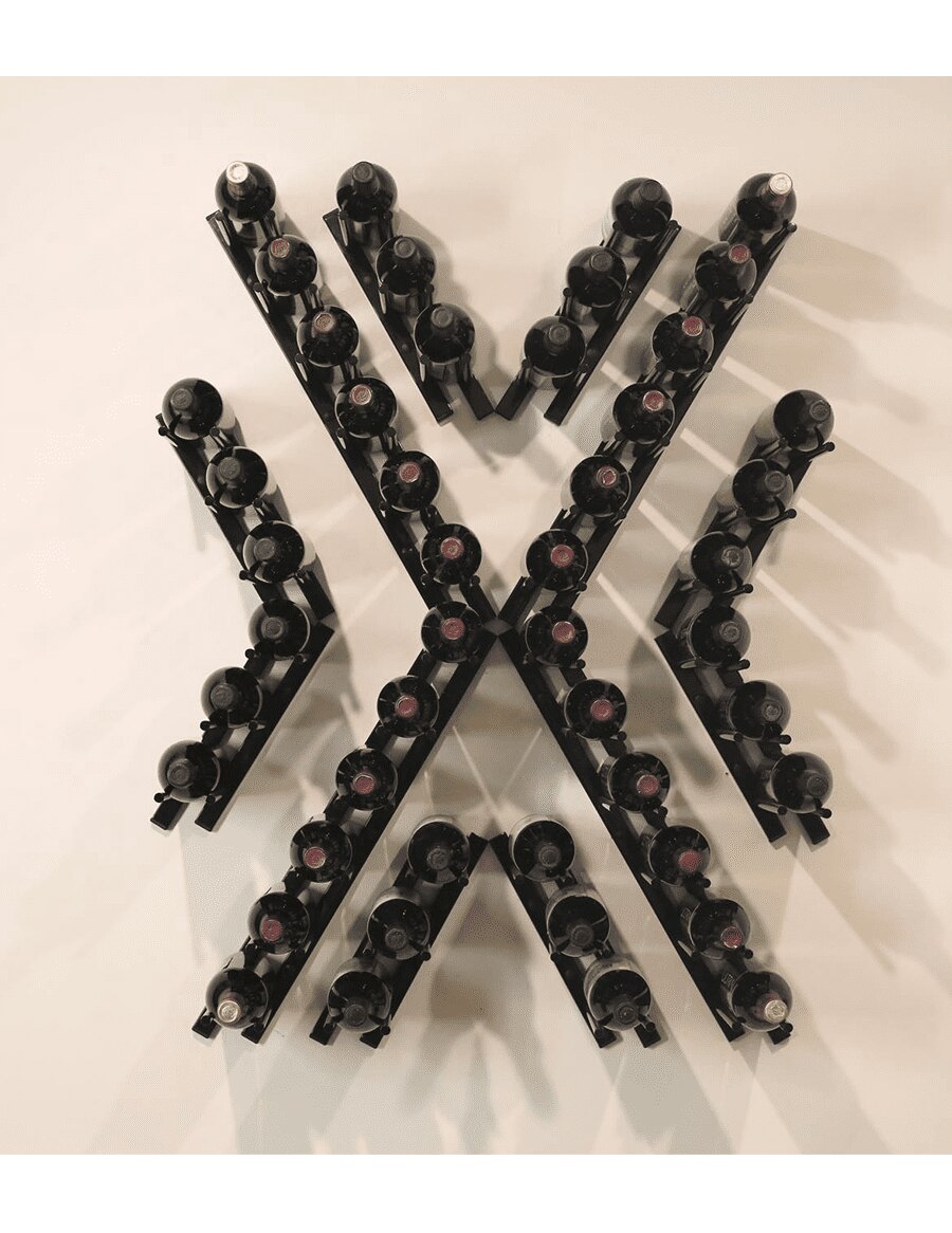 Black metal wine rack in an X shape with cork-out bottle pegs