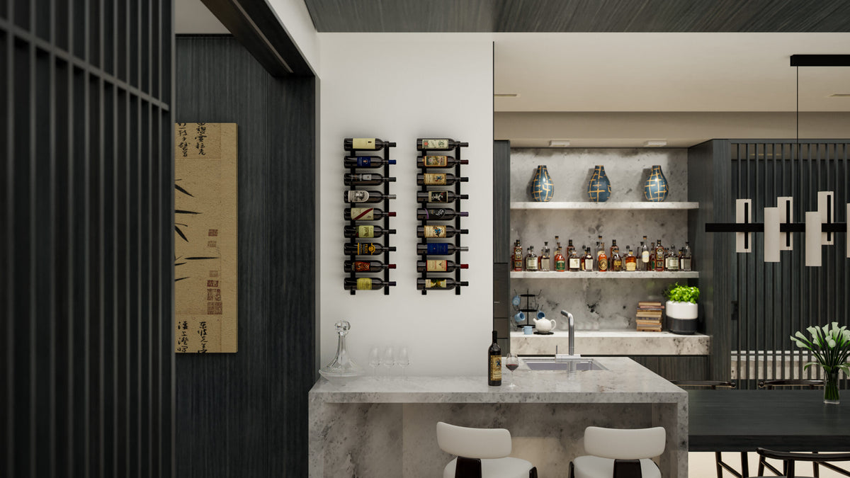 Wall-mounted metal wine rack holding dark wine bottles against a wall