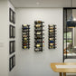 Wall-mounted wine rack display with multiple bottles on black frames.