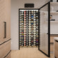 Wine bottle display rack with label-out bottles inside open cabinet frame