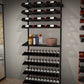 Wall liquor shelf display kit with stacked angled bottle racks and side bottle ledge