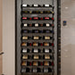 Wine storage cabinet interior with black bottle rack and assorted bottles on tiers