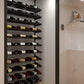 Wine storage rail kit with bottles on horizontal rails in a cellar