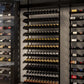 Tall wine bottle display rack with many tiers and assorted bottles