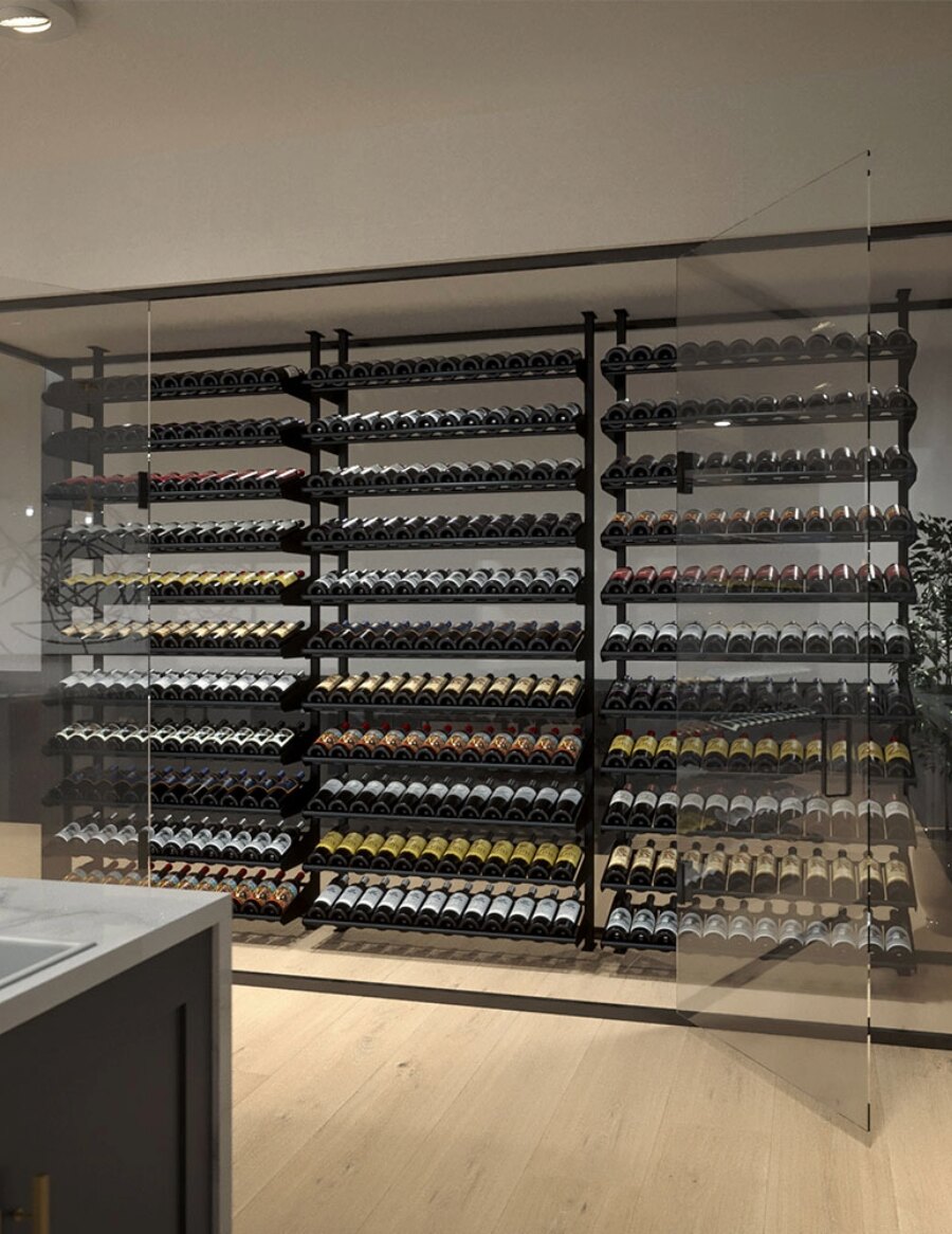 Tall wine bottle display wall with multiple tiers of assorted wine bottles