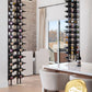 Two wall-mounted wine bottle racks with dark frames and label-out pegs