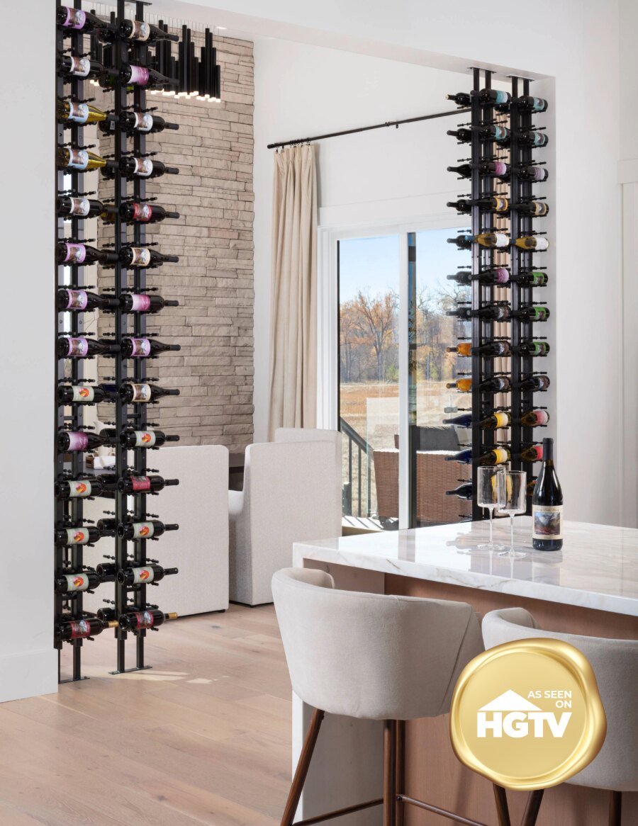 Two wall-mounted wine bottle racks with dark frames and label-out pegs