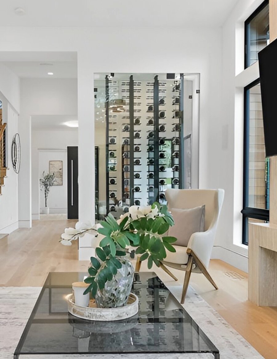 Glass-front wall wine bottle rack with label-out pegs and bottle holders