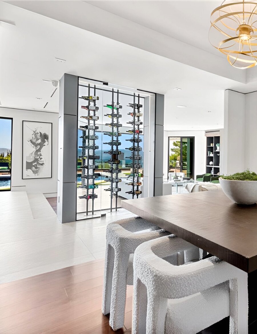 Wine bottle display unit with glass panels and label-out peg compartments