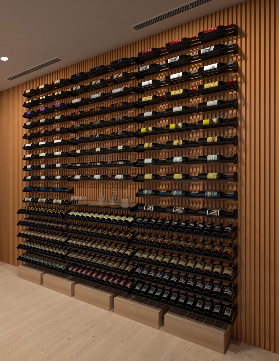 Large label-out bottle display wall with black racks holding bottles on open shelves