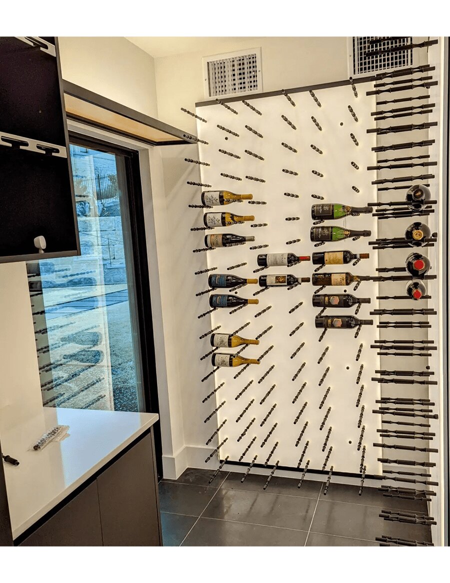 Wine peg wall with multiple bottle holders and hanging pegs