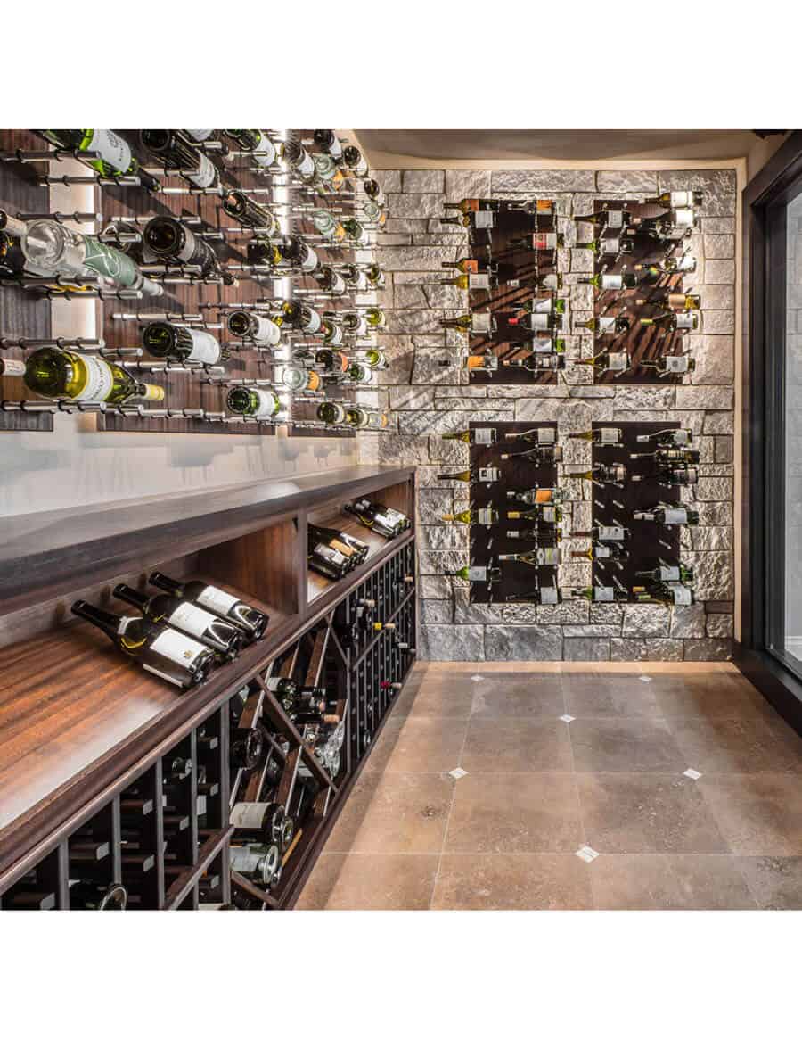 Wine bottle peg wall display with many bottle holders and pegs
