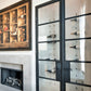 Wine bottle wall unit with clear panels and metal peg bars for bottle storage