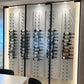 White acrylic wine bottle wall display with metal pegs for multiple bottles