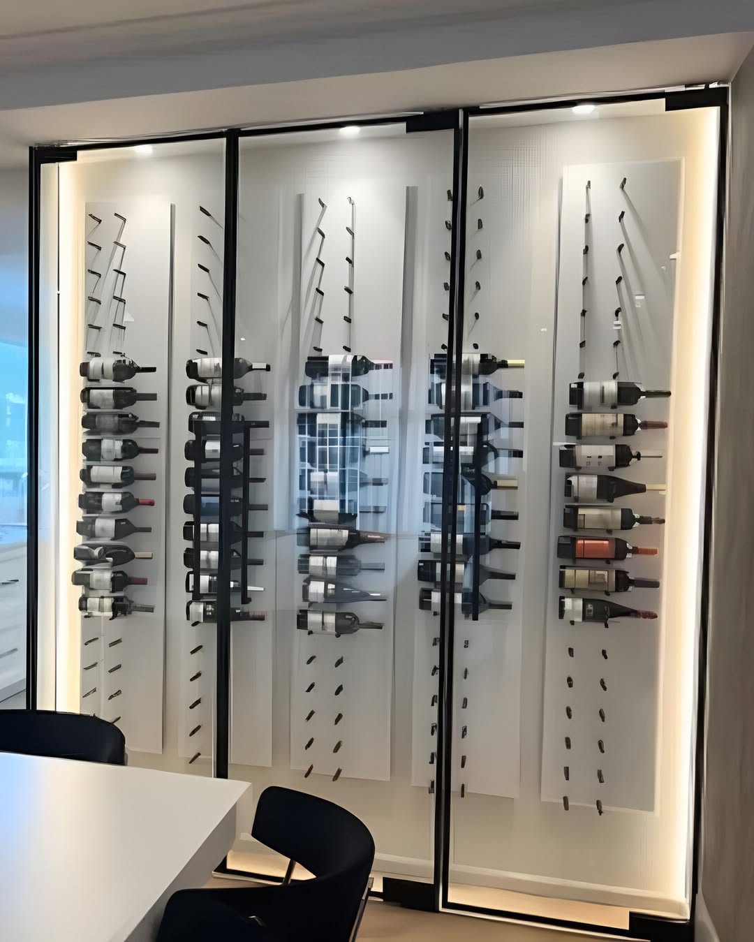 White acrylic wine bottle wall display with metal pegs for multiple bottles