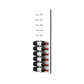 Wine bottle display wall with black pegs on white acrylic, bottles in vertical rows