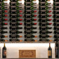 Aluminum wine bottle display wall with tightly arranged bottles in a wall grid
