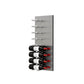 Wine bottle display wall with brushed aluminum pegs holding four label-out red wine bottles