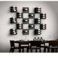 Black wine wall rack with multiple horizontal pegs holding bottles in a grid