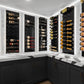 Black wine bottle wall panels with peg rails holding assorted bottles