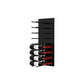 Black acrylic wine bottle wall rack with peg rows and several wine bottles stored below.