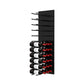 Black acrylic wine bottle wall rack, angled view with peg rows and stacked bottles.