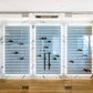 Wine bottle wall display with three white acrylic panels and rows of bottles on pegs