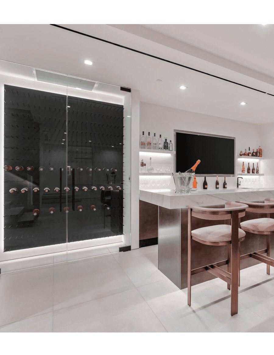 Black acrylic wine bottle display wall with rows of bottles