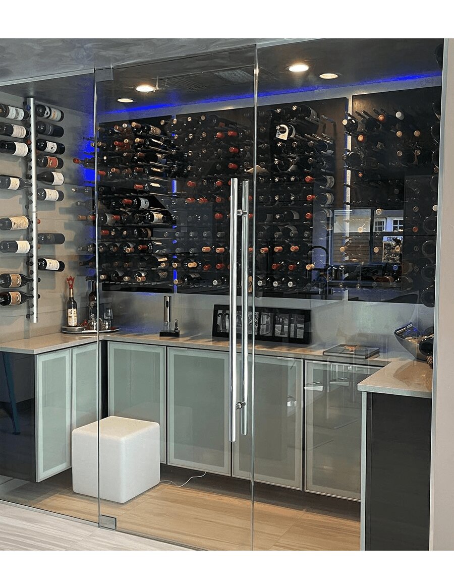 Black acrylic wine bottle display wall with multiple rows of bottles