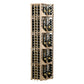 Curved corner wine wall display in light wood, four columns of bottles behind slatted panels.