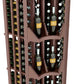 Dark wood wine display close-up with curved compartments holding wine bottles