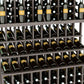 Close-up of dark wine bottles arranged in rows within a wooden bottle holder rack