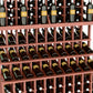 Triple-tier wine bottle display with cherry-red lattice shelves holding green bottles