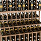Triple-tier wine bottle display rack with double-deep base; dark wood and rows of wine bottles