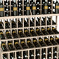 Close-up of tiered wine bottle display rack showing bottles and cradle shelves.