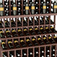 Close-up view of wine bottles seated in a wooden grid rack with dark bottles