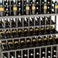 Wine bottle display rack close-up of bottles in dark grid shelves with labels