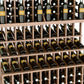 Close-up of wine bottle rack shelves with dark bottles in a wooden crisscross frame