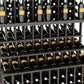 Close-up of wine bottle display rack with three bottle shelves and wooden slot frame