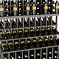 Close-up view of wine bottle slots in a dark-toned wooden wine rack frame