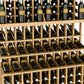 Close-up of triple-tier wine rack holding dark bottles in wooden grid storage