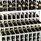 Triple-tier wine bottle display rack with double-deep base; whitewashed wood frame and bottle slots