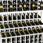 Triple-tier wine bottle display rack in white-finished frame with three rows of bottles.